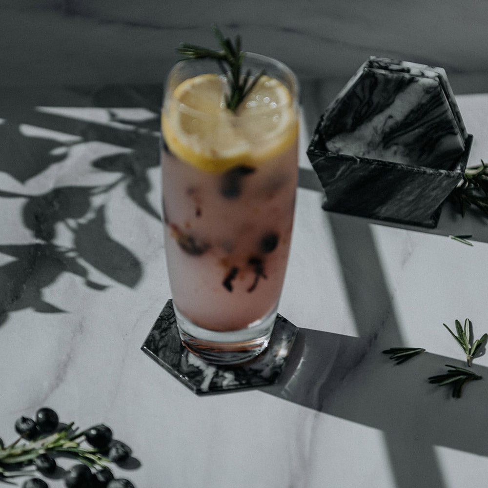 Porta vasos de mármol hexagonal